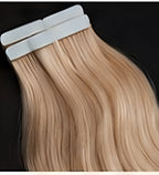 Tape-in wefts laid flat